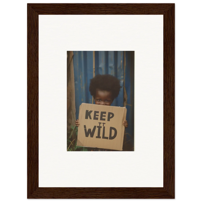 Framed photograph of a person with a KEEP IT WILD sign for room decoration, Wild Innocent Harmony