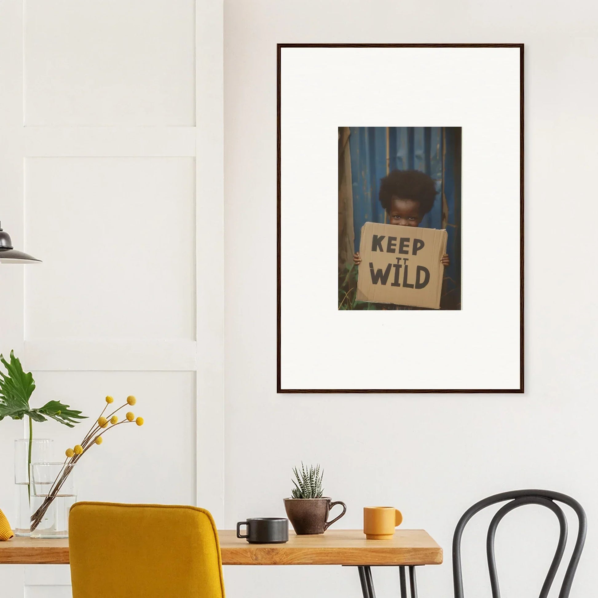 Framed canvas print of a person with a KEEP WILD sign, perfect for room decoration