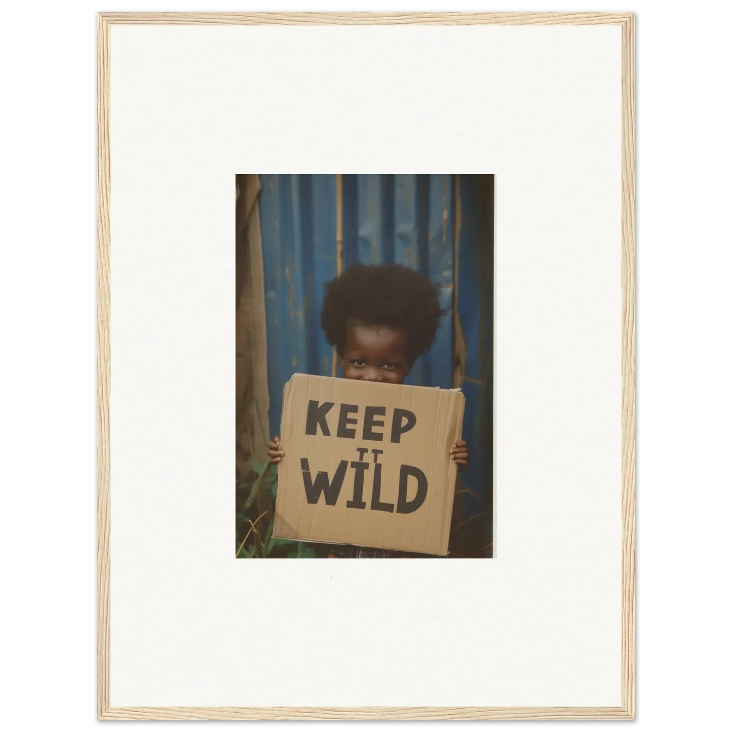 Framed canvas print of a person with a Keep It Wild sign for room decoration