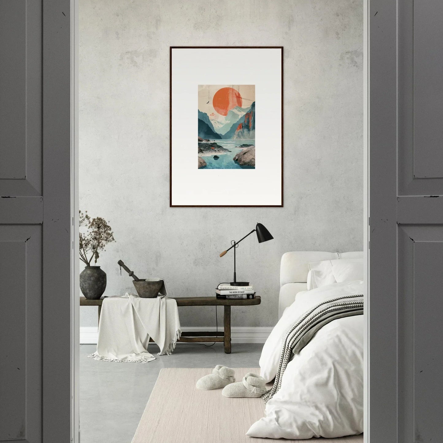 Framed wall art of mountains, water, and a red sun for vibrant room decor