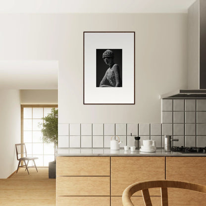 Modern kitchen with wooden cabinets, tiled backsplash, and framed wall art decor