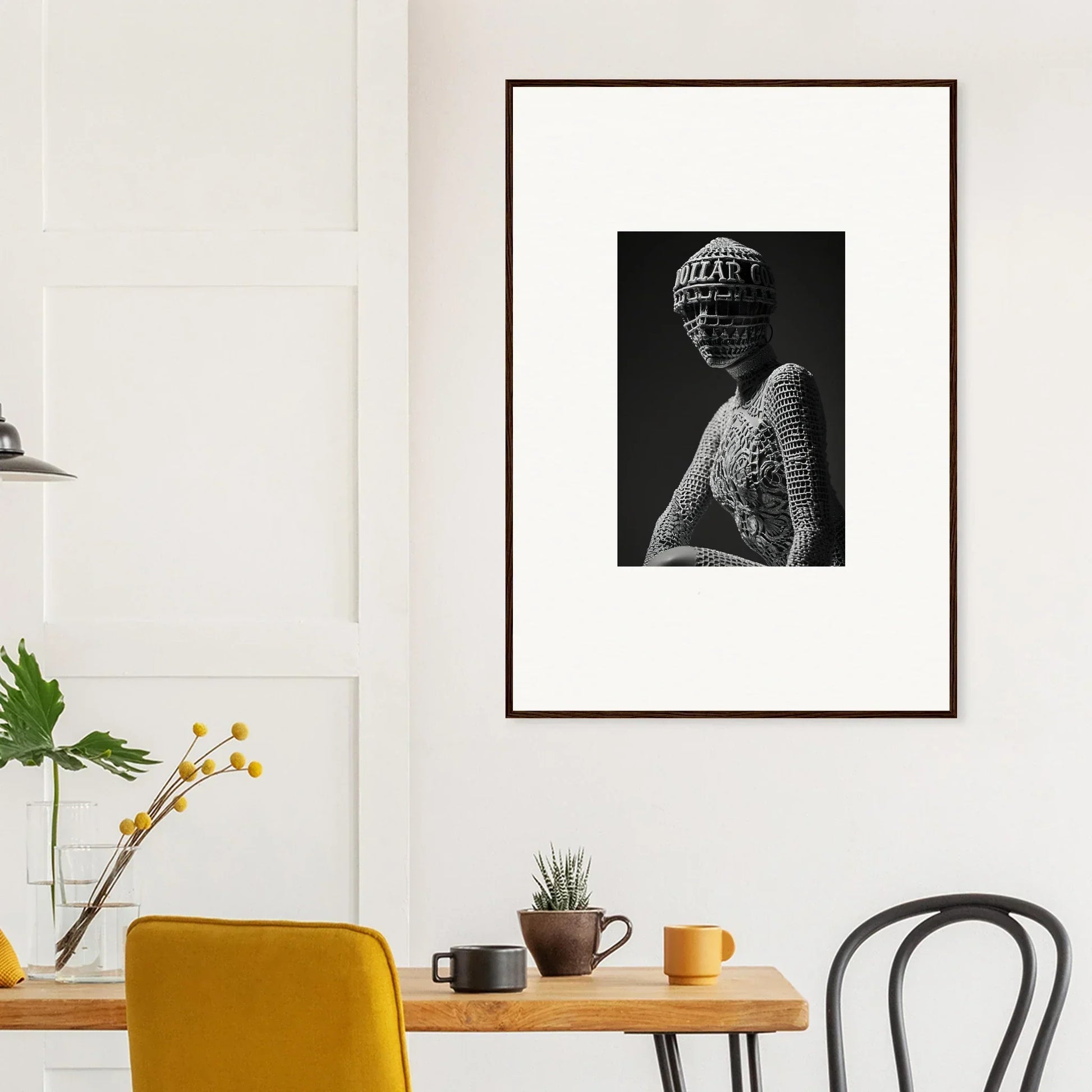 Framed black and white photograph of a sculptural bust, perfect for room decor