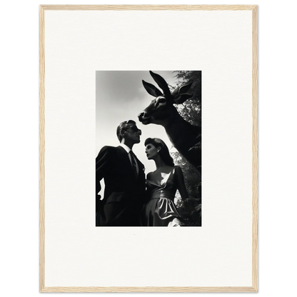 Black and white photograph of a couple with a large rabbit head looming above them.