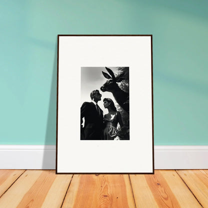 Framed black and white photograph showing two figures and a donkey.