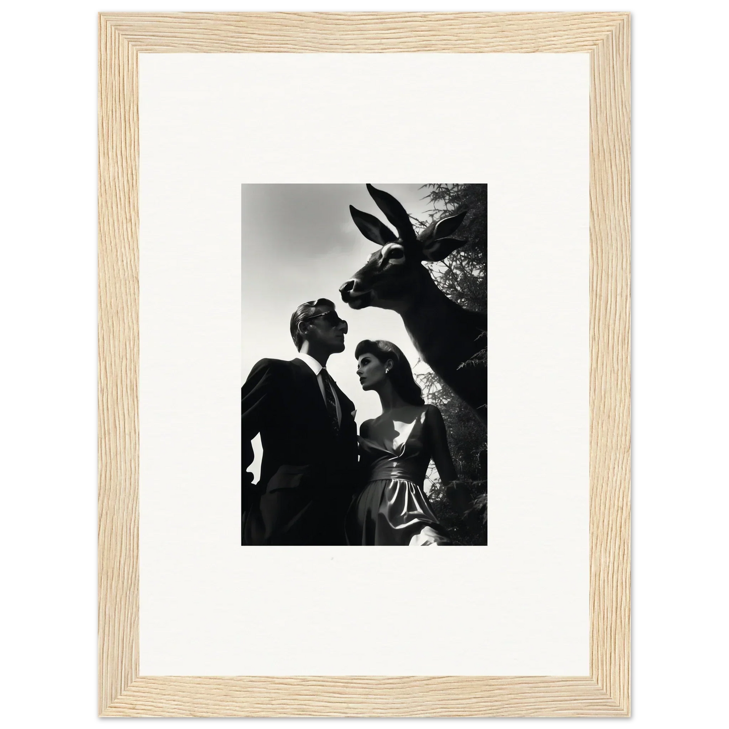 Framed black and white photograph of two people and a donkey.