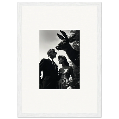 Black and white photograph of a couple with a donkey peering over their shoulders.