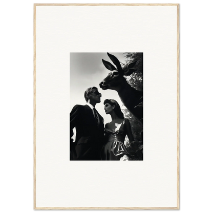 Black and white photograph of a couple with a donkey peering over their shoulders.