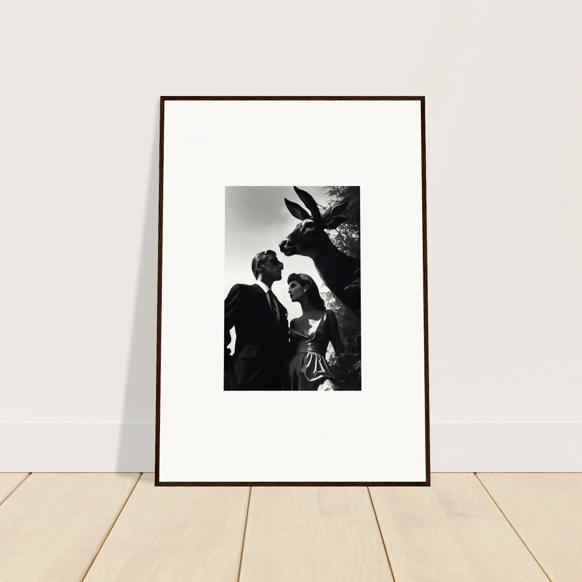 Framed black and white photograph showing a couple and a donkey.