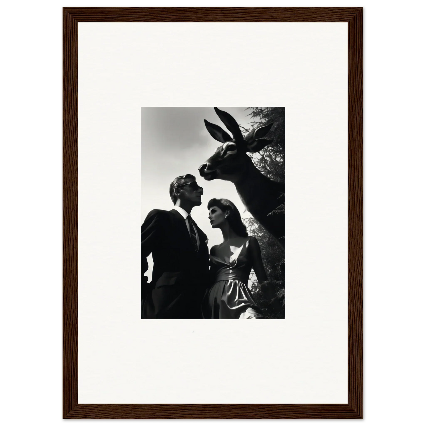 Framed black and white photograph of a couple with a donkey peering over their shoulders.