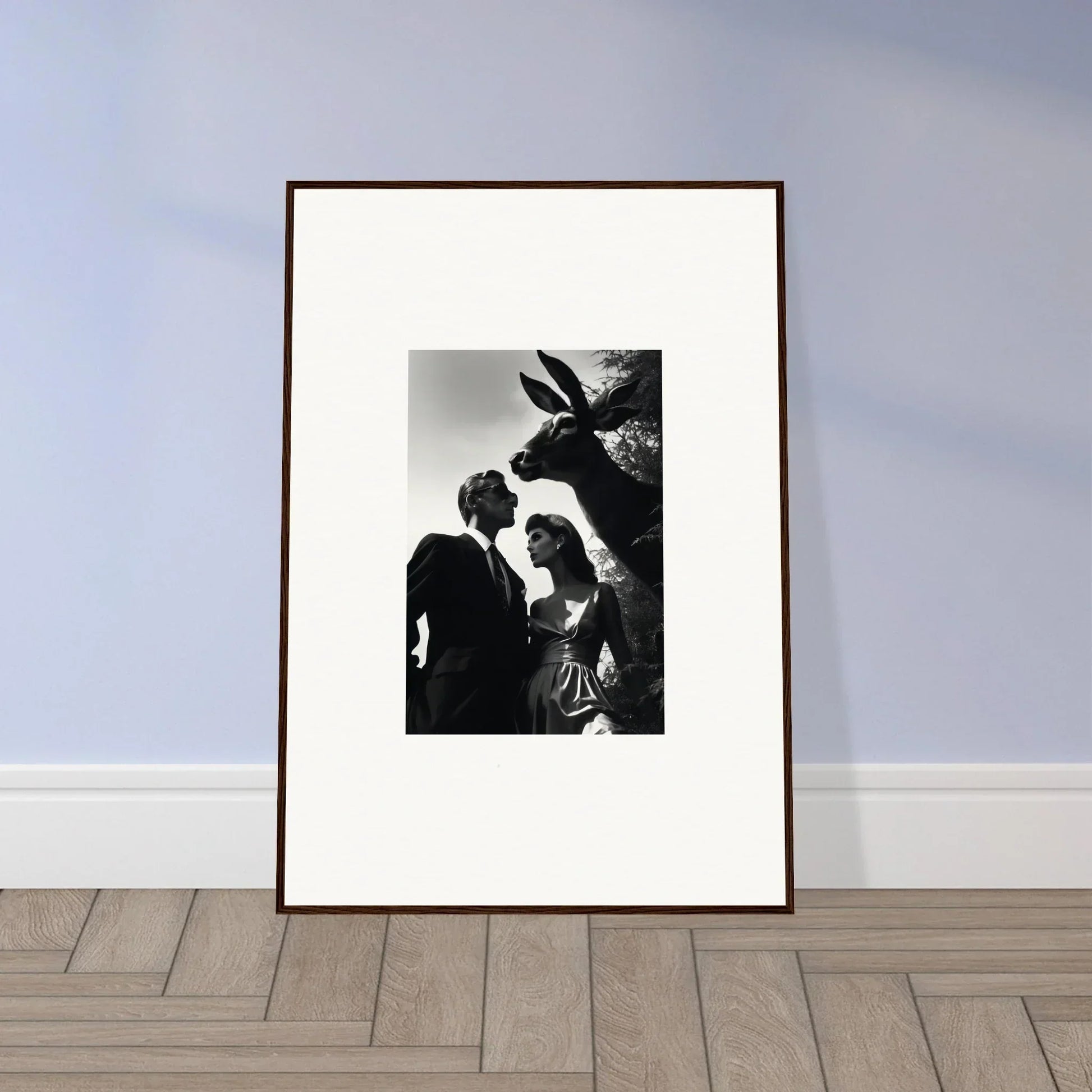 Framed black and white photograph of a couple standing near a palm tree.