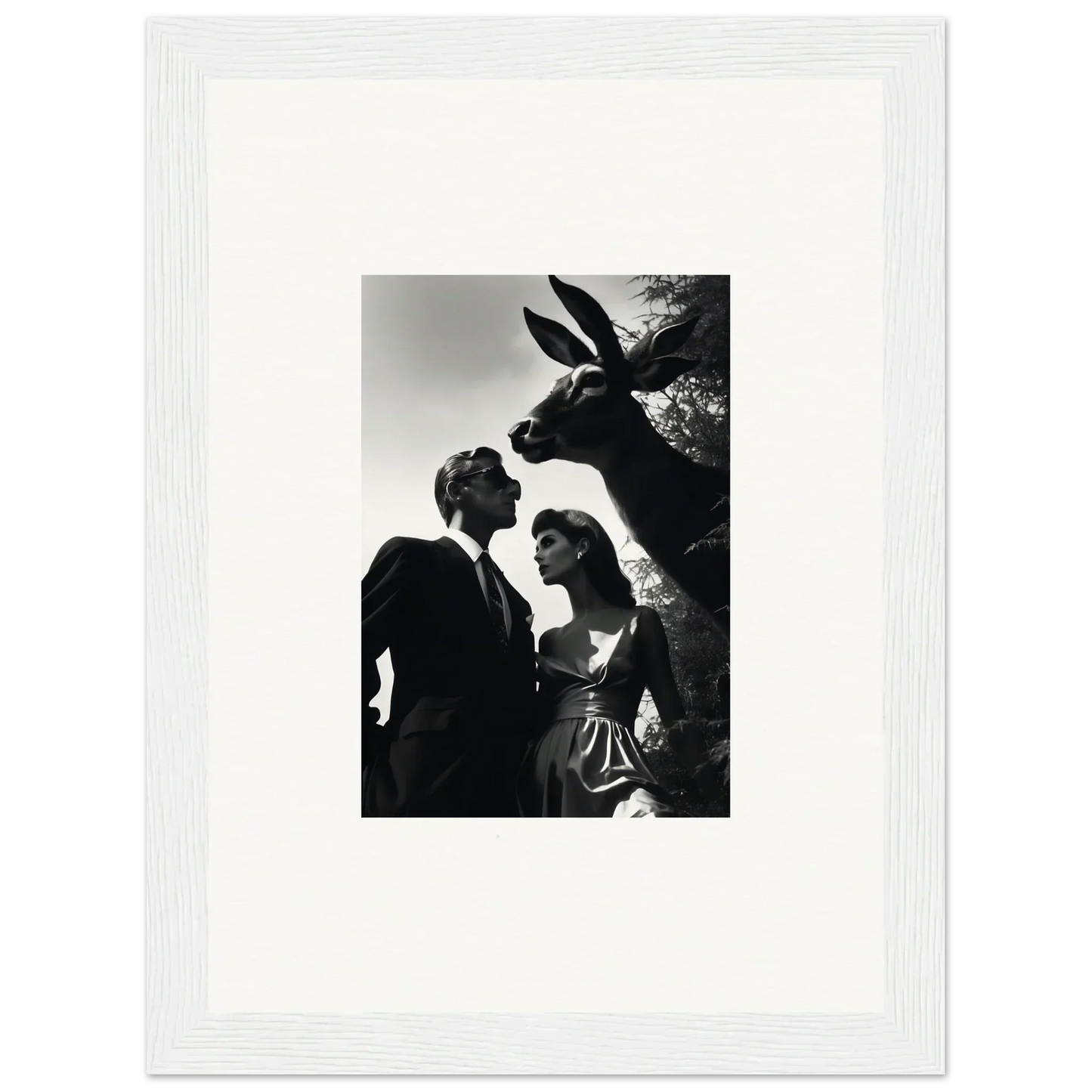 Black and white photograph of a couple with a large animal head looming above them.