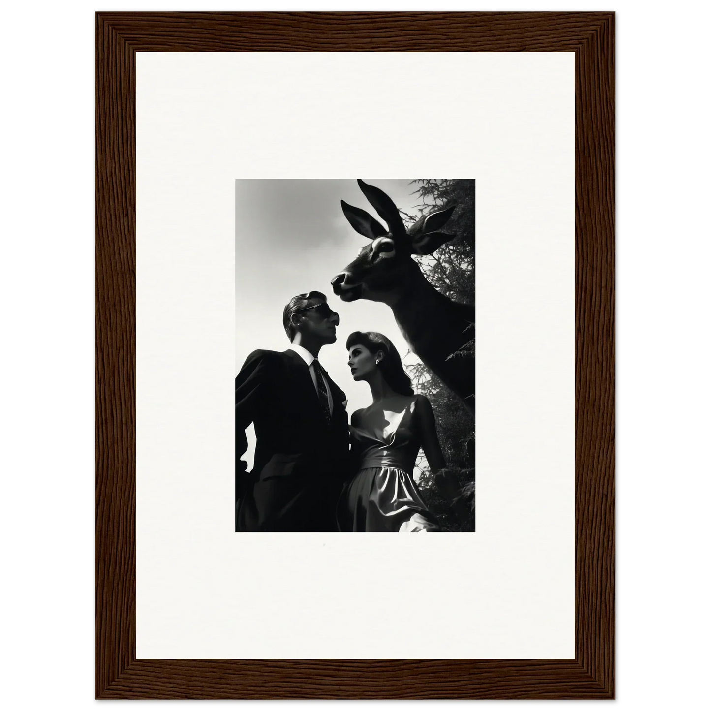 Framed black and white photograph of a couple with a donkey peering over their shoulders.