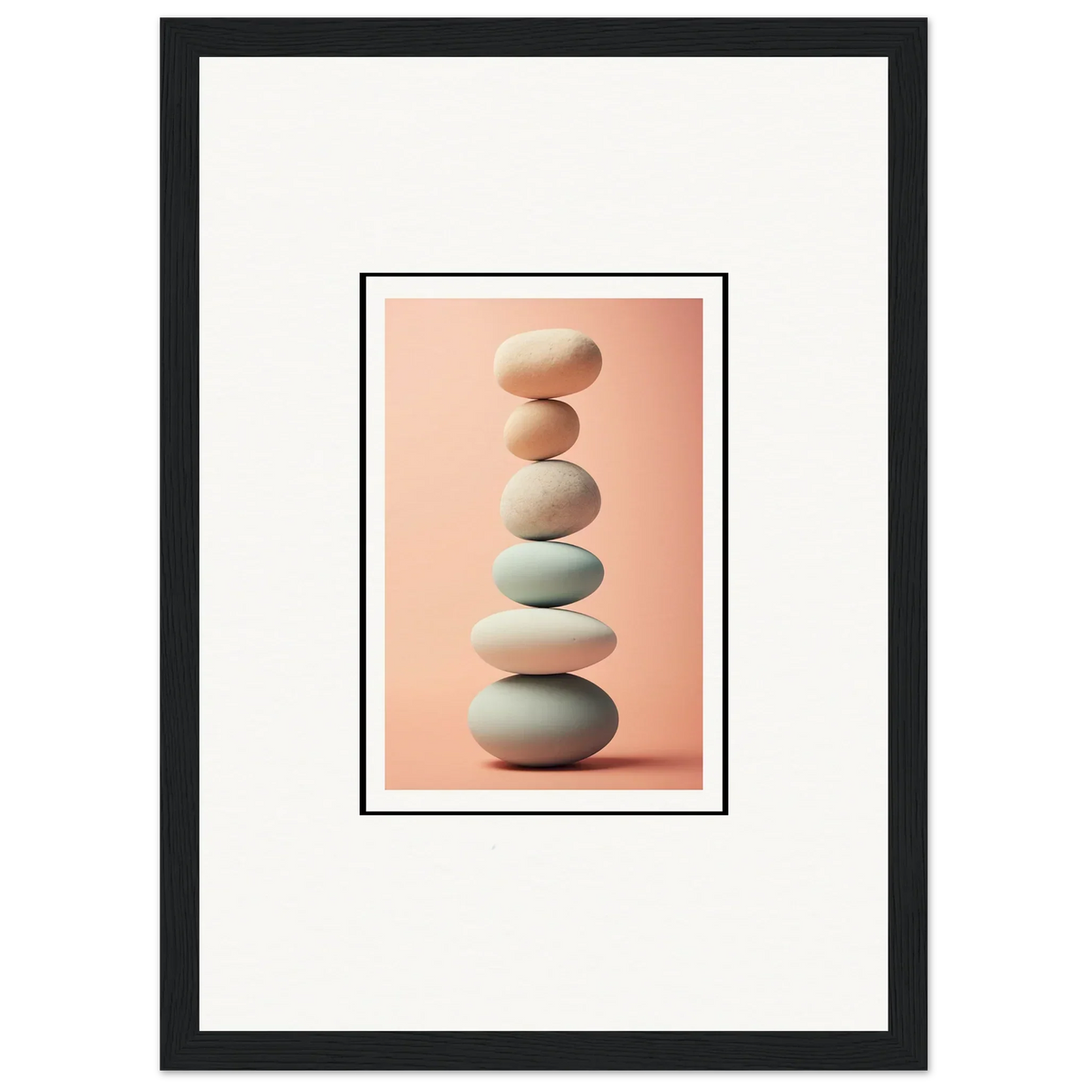 Smooth gray and white stones stacked for rock contemplation in stylish room decoration