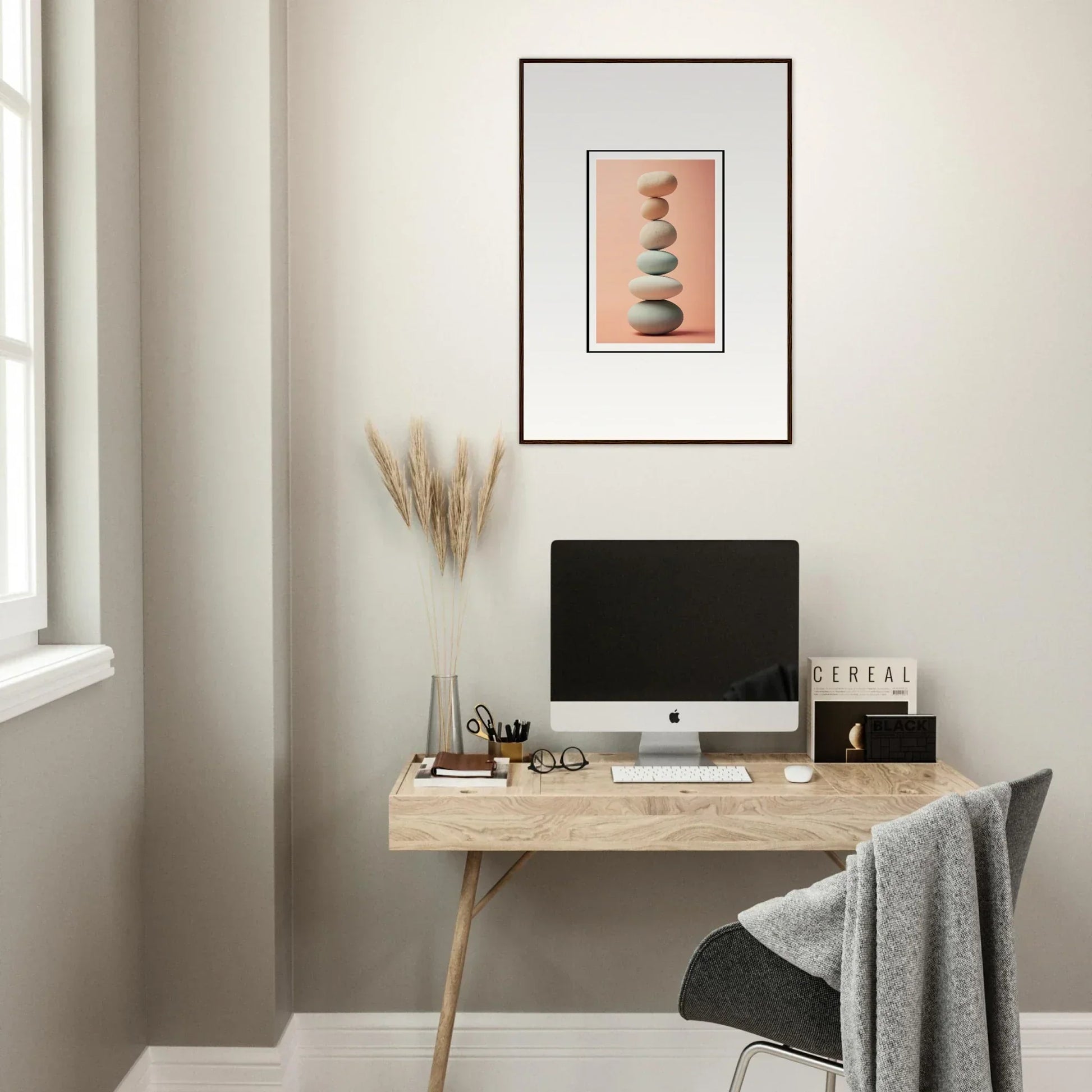 Minimalist workspace with wooden desk, computer, and Zen Rock Contemplation canvas print