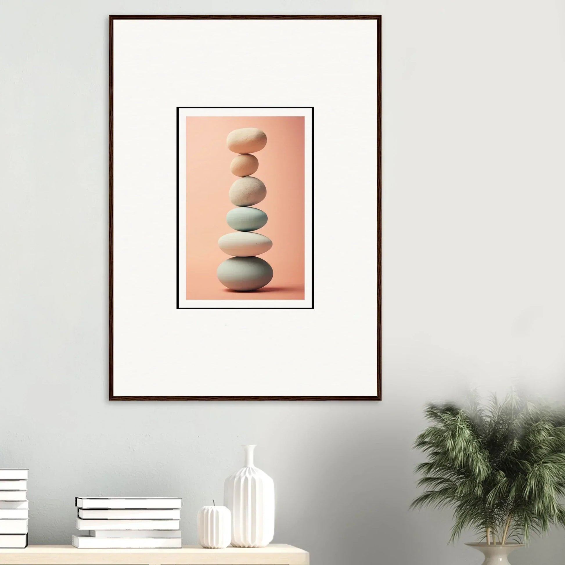 Pastel stones stacked for rock contemplation on a peachy-pink canvas print