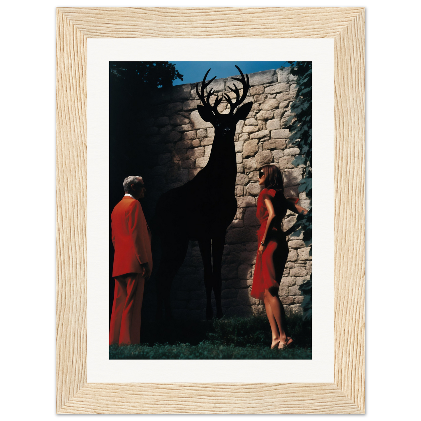 A framed print of a deer and a woman