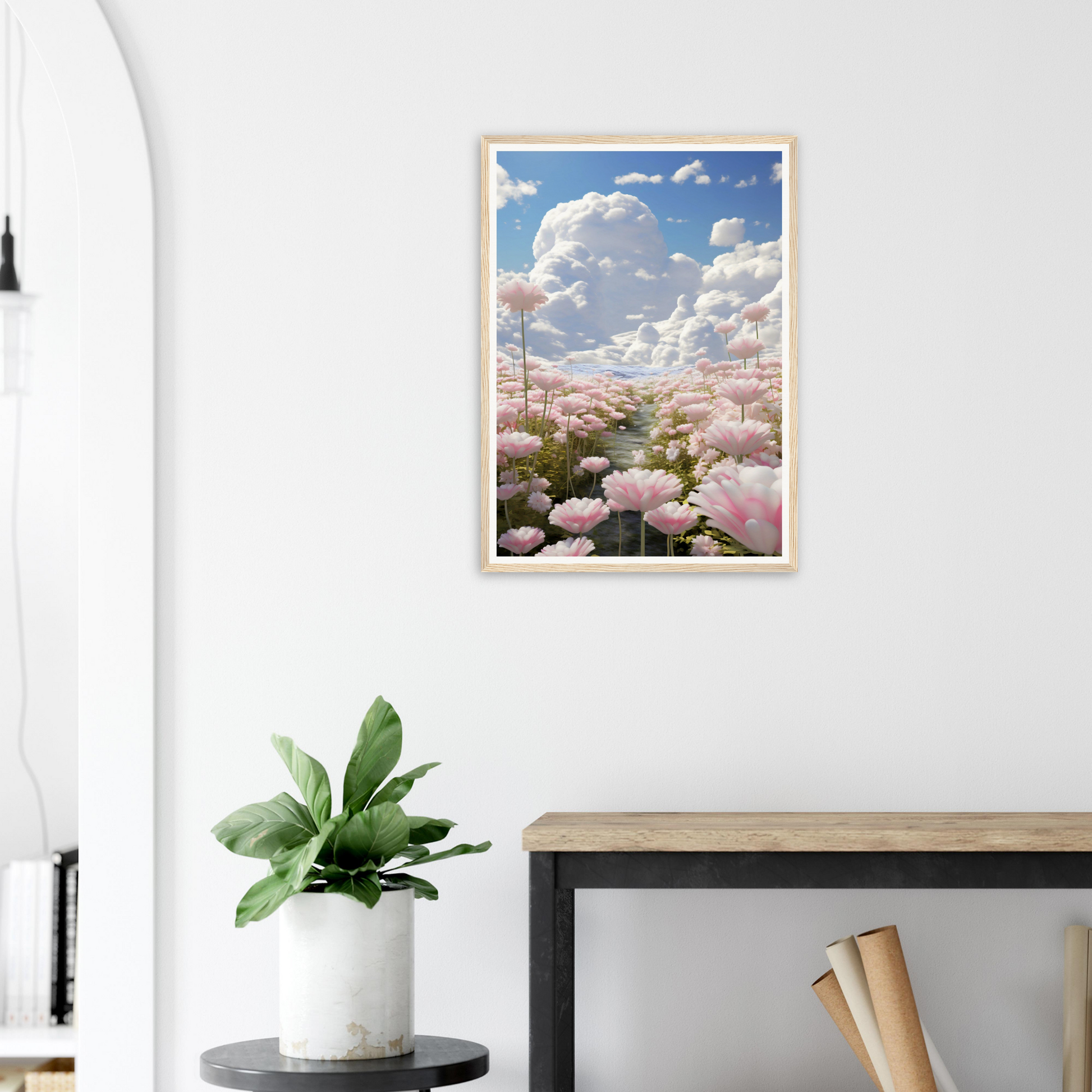 A framed print of pink peonium flowers against a white wall