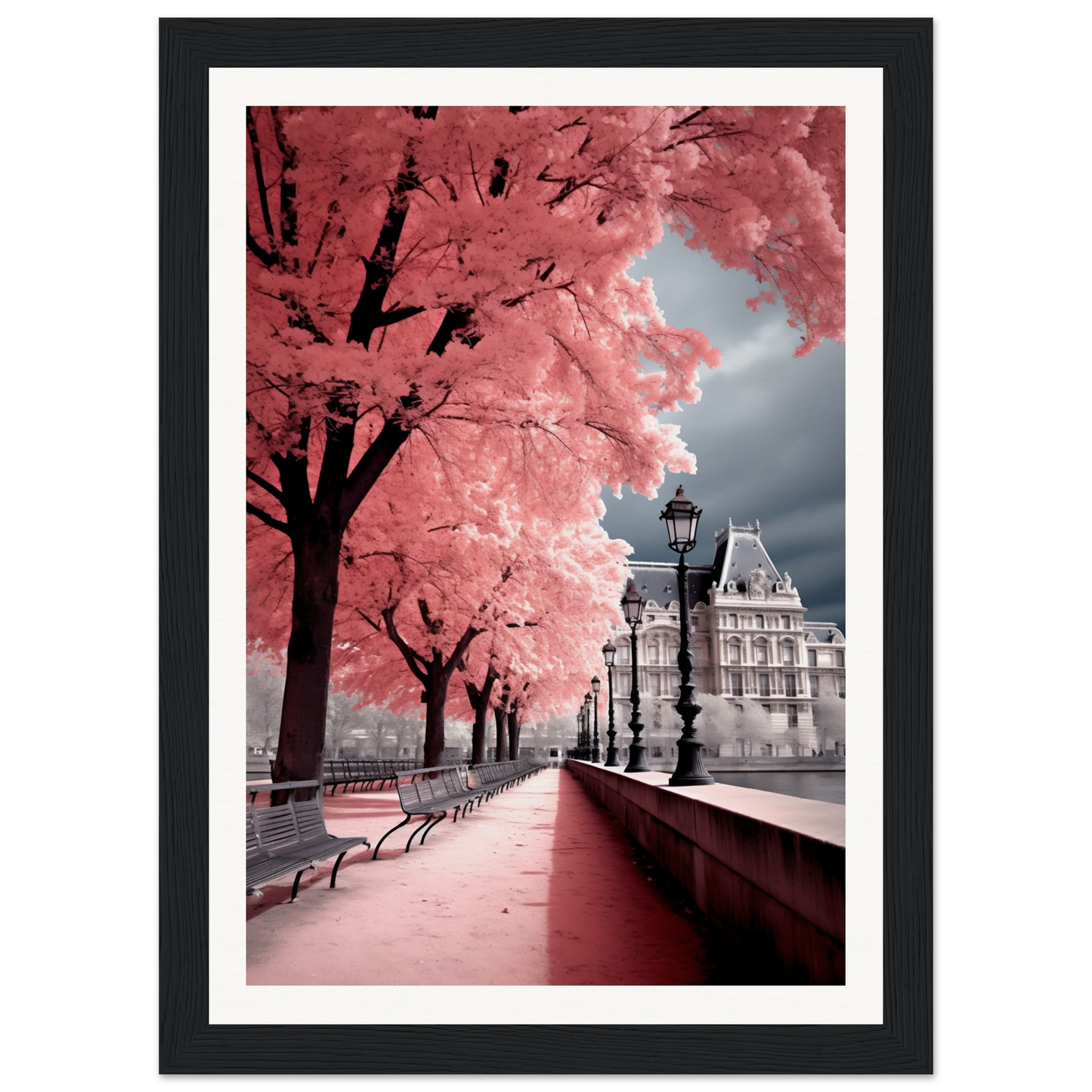 A framed print of a pink tree in the city