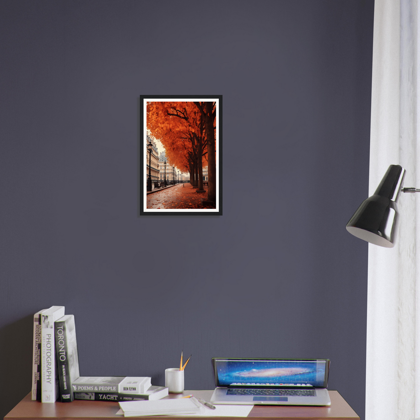 A framed print of a street scene with a red tree