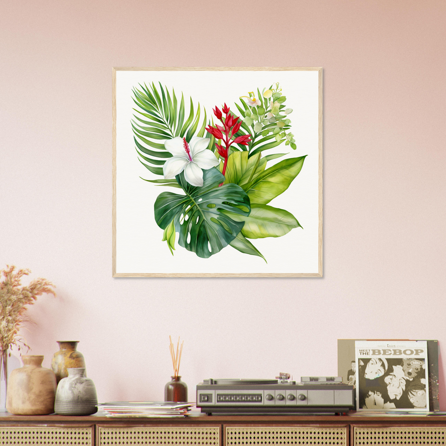 A framed print of a tropical plant with red flowers