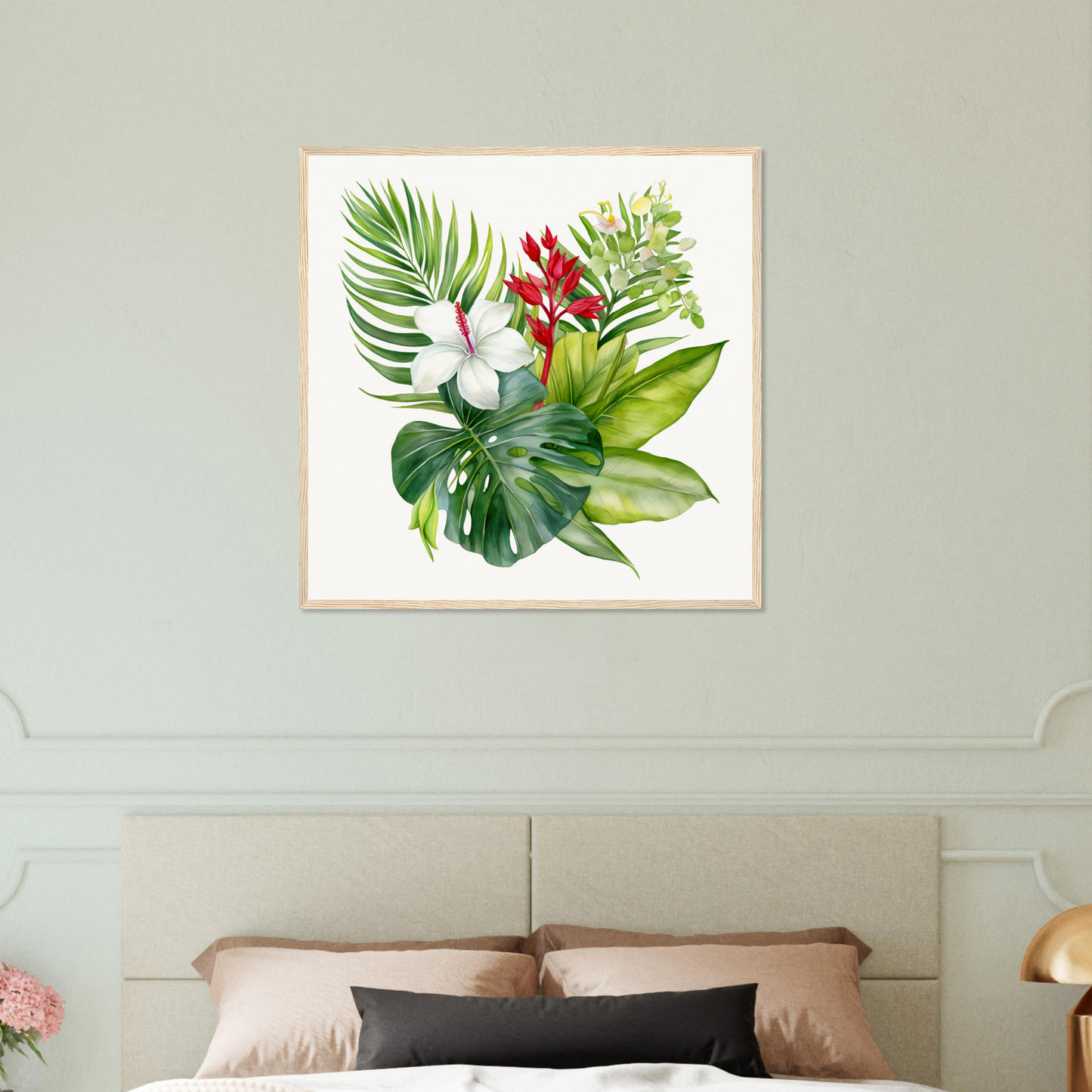 A framed print of a tropical plant with red flowers