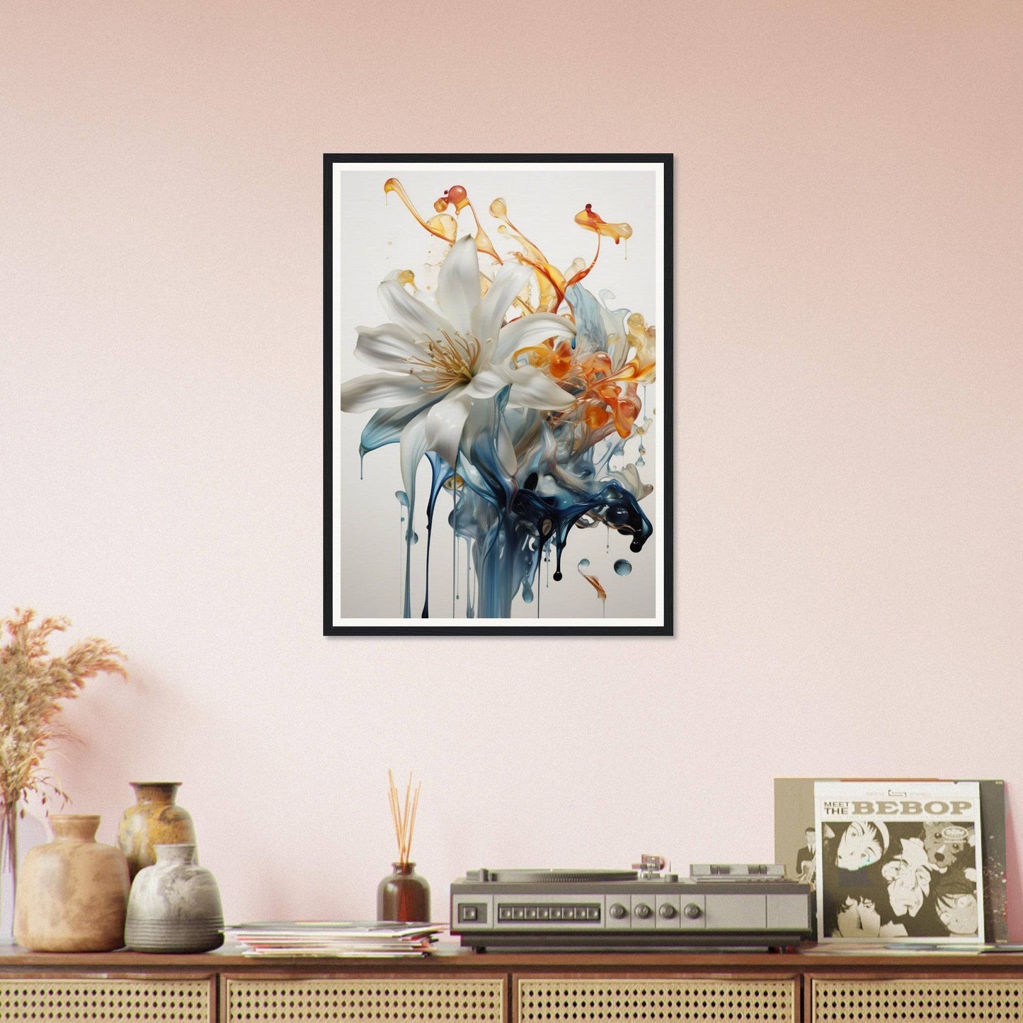 A framed print of a white flower on a pink wall