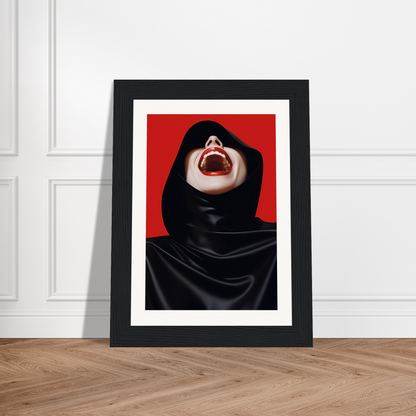 A framed print of a woman in a black hoodie