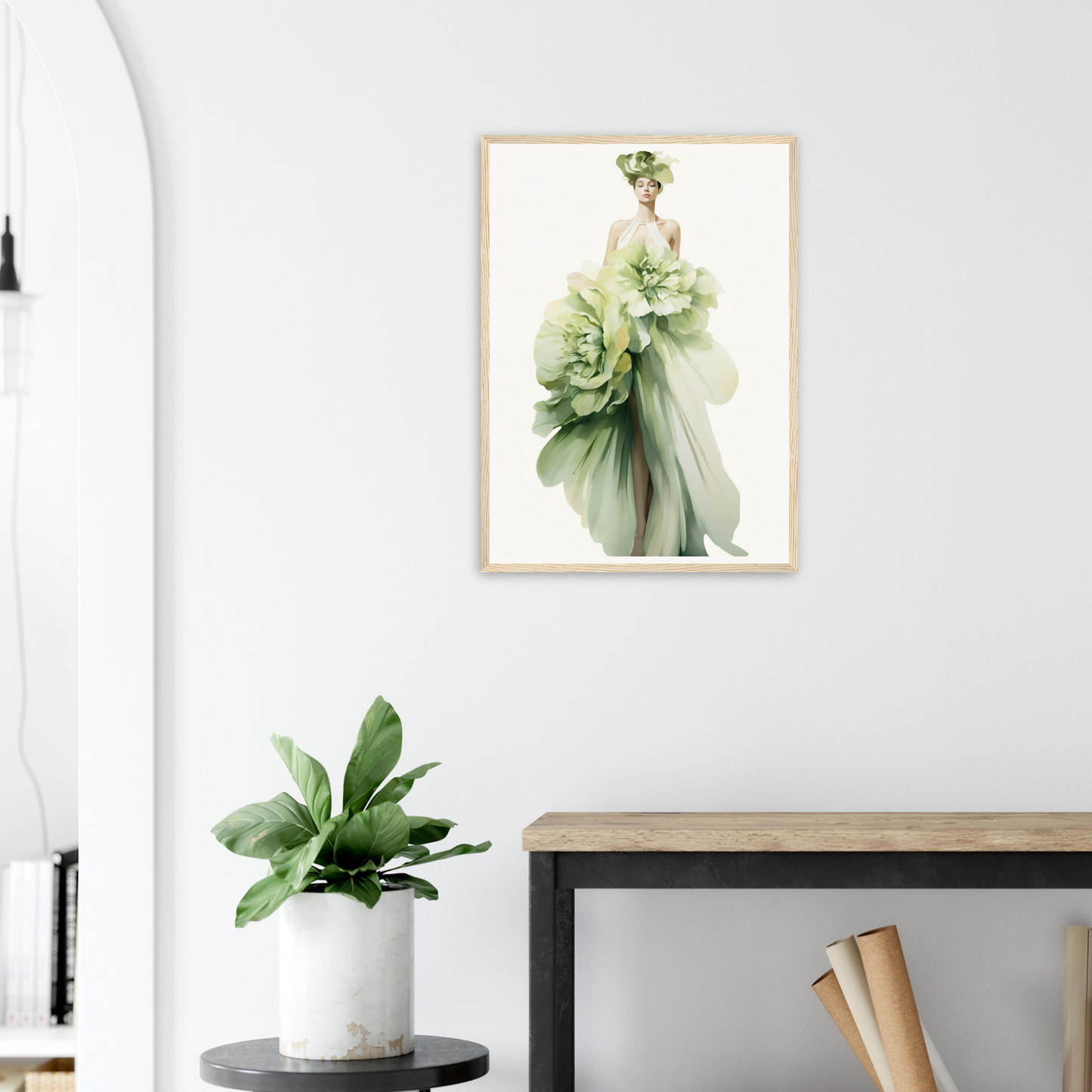 A framed print of a woman in a green dress with flowers