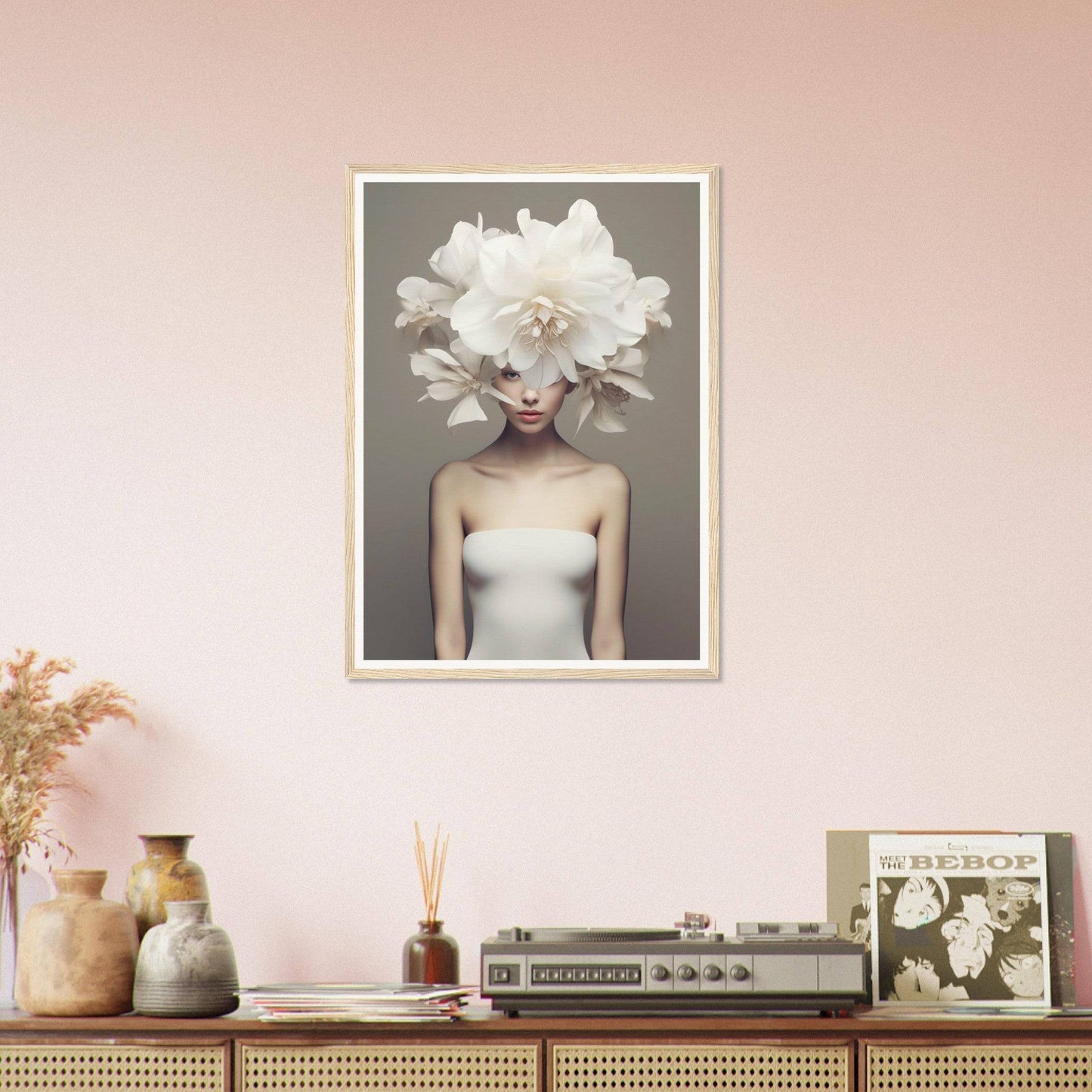 A framed print of a woman with a large white flower on her head