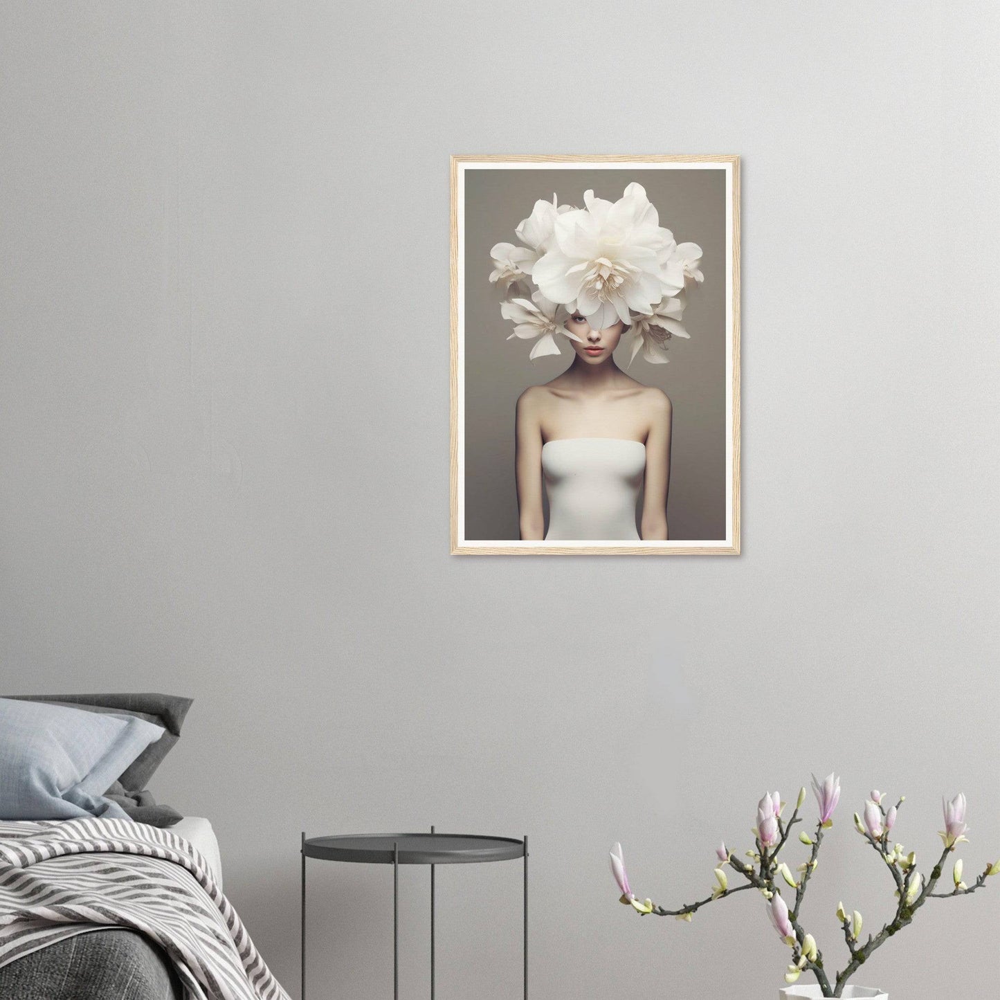 A framed print of a woman with a large white flower in her hair