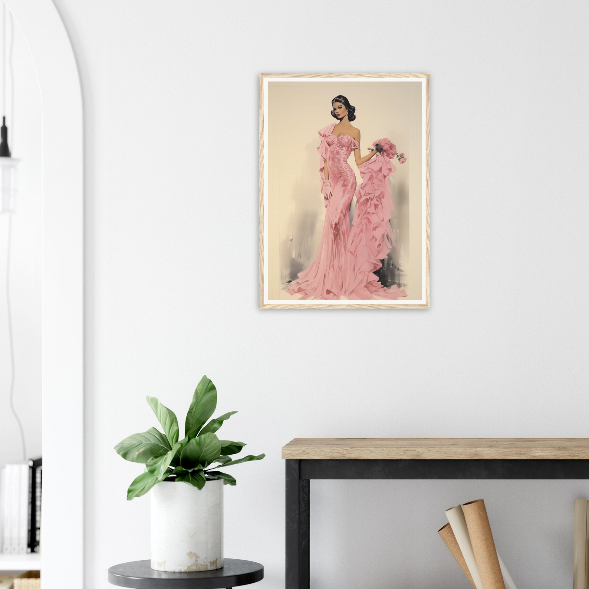 A framed print of a woman in a pink dress