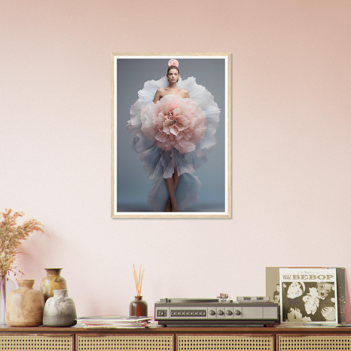 A framed print of a woman in a pink dress