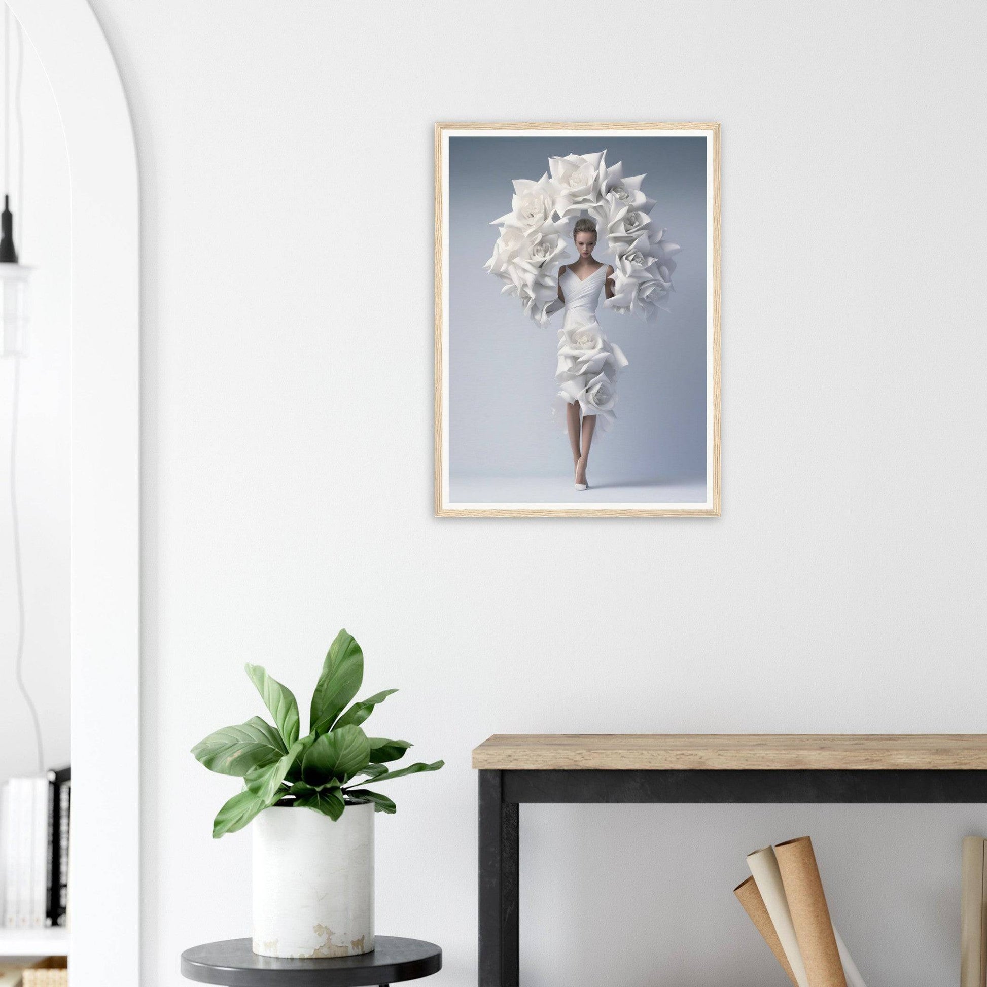 A framed print of a woman in a white dress with flowers on her head