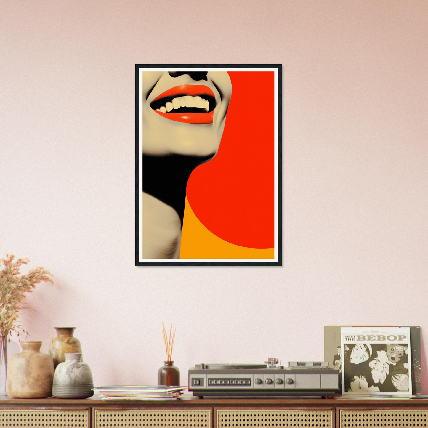 A framed print of a woman’s face with a red and yellow background