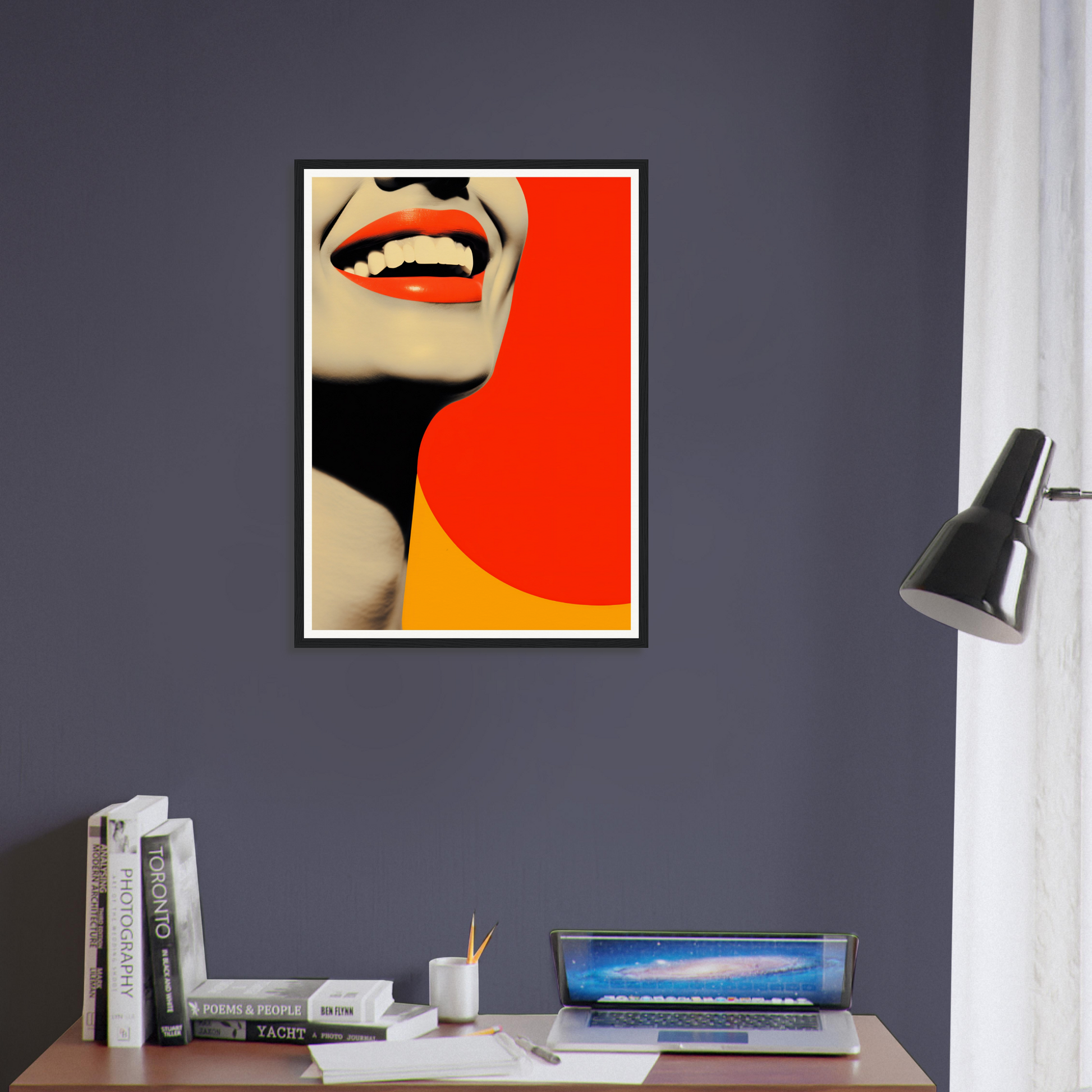 A framed print of a woman’s face with a red and yellow background