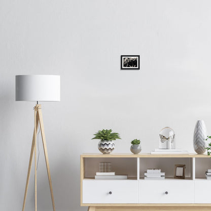 Wooden sideboard with white drawers and open shelving displaying decorative objects and plants.