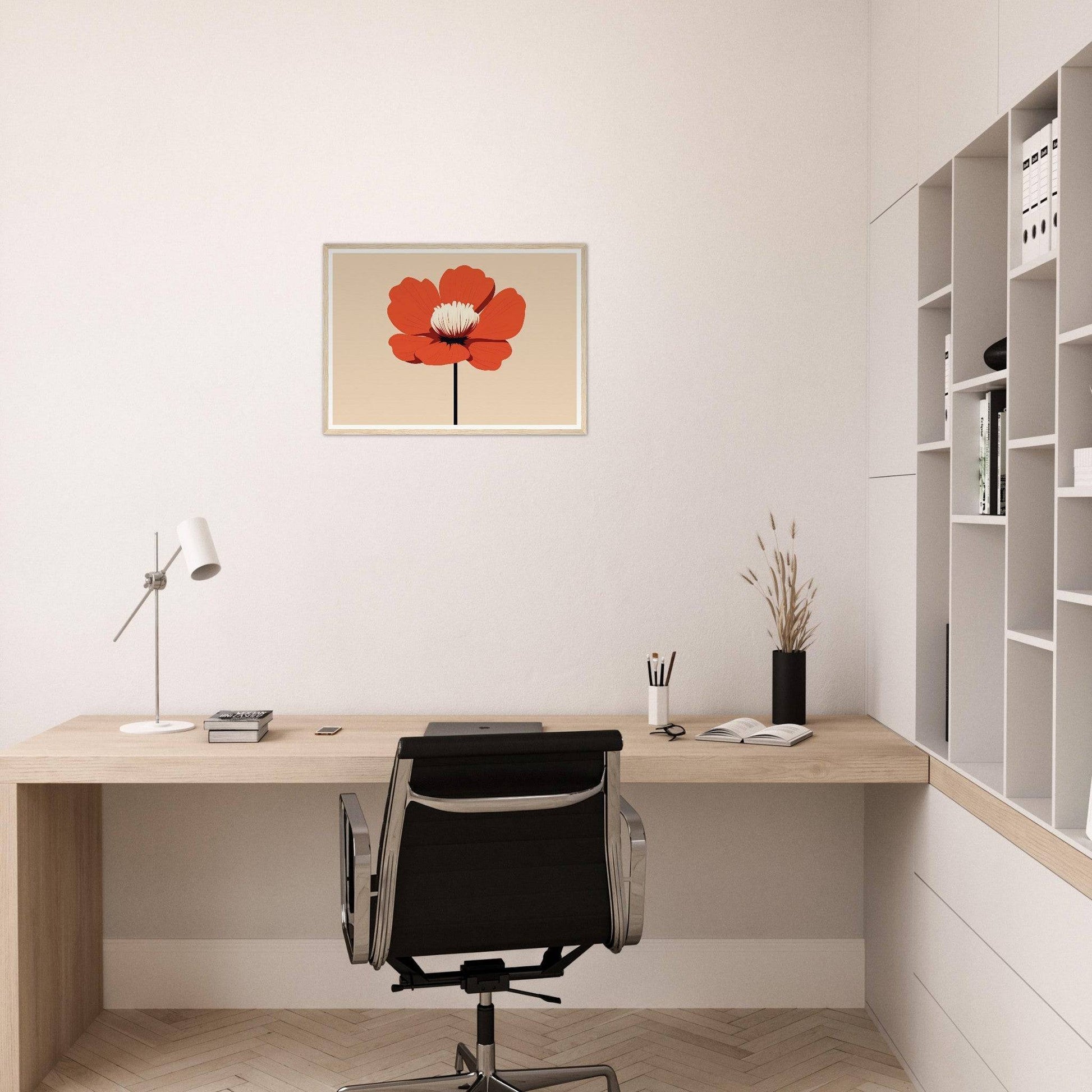 Minimalist home office workspace with a wooden desk, black office chair, and red flower artwork on the wall.