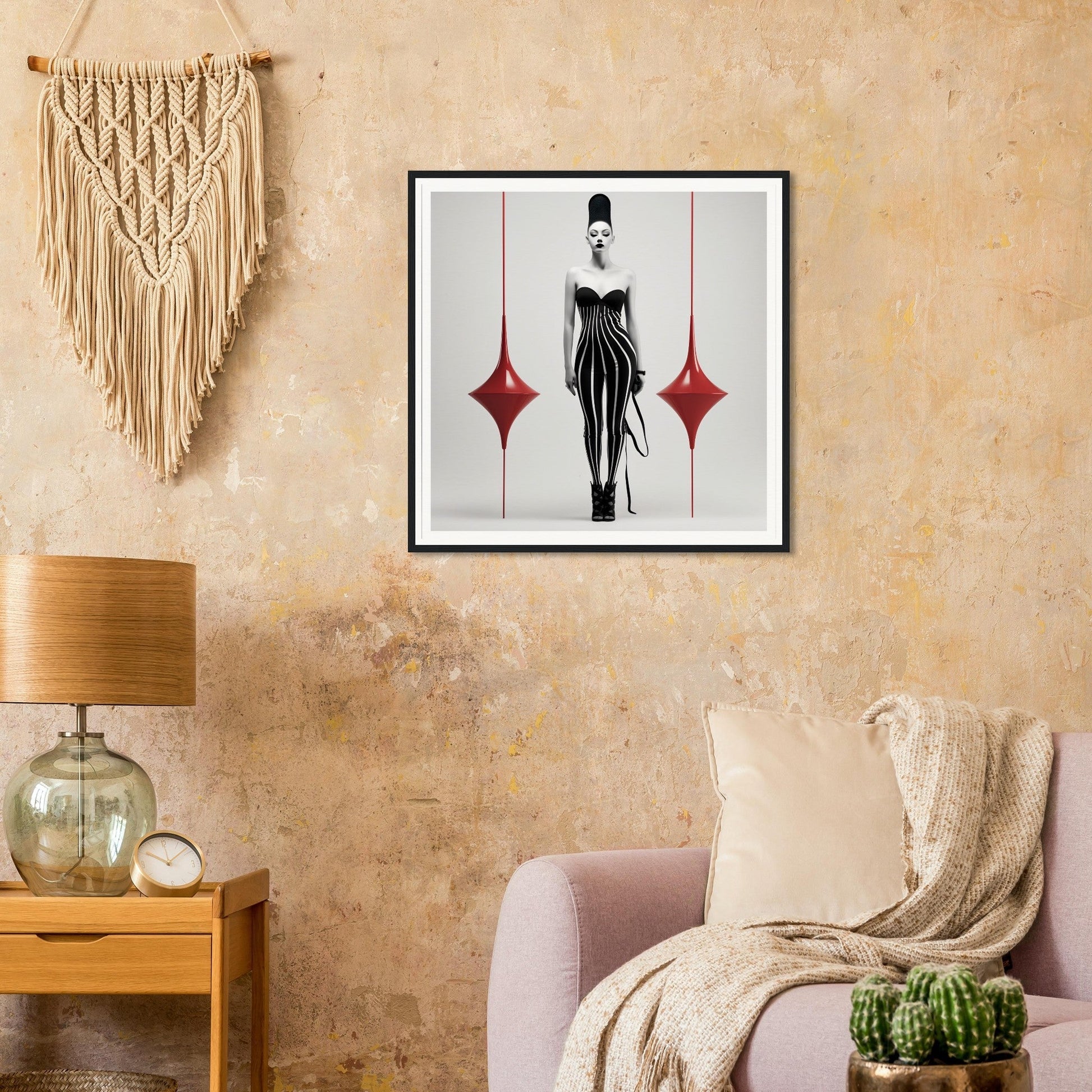 Framed artwork depicting a stylized female figure in a black dress flanked by red diamond shapes.