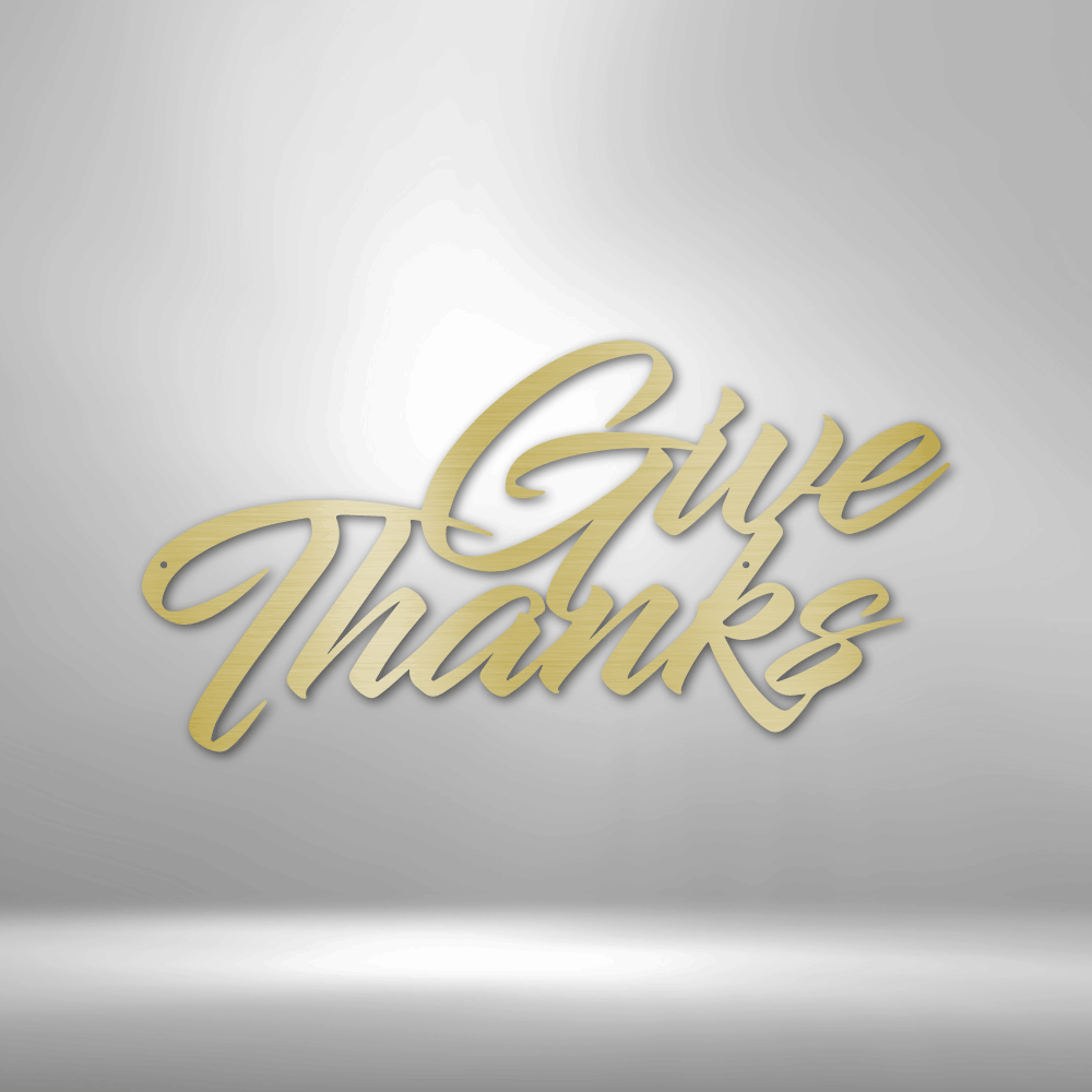 Cursive text saying ’Give Thanks’ in gold-colored lettering.