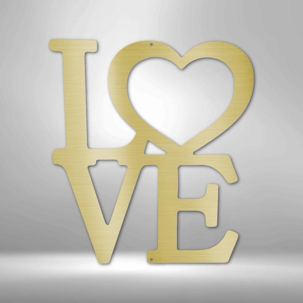 Gold-colored ’LOVE’ text sculpture with the ’O’ shaped as a heart.