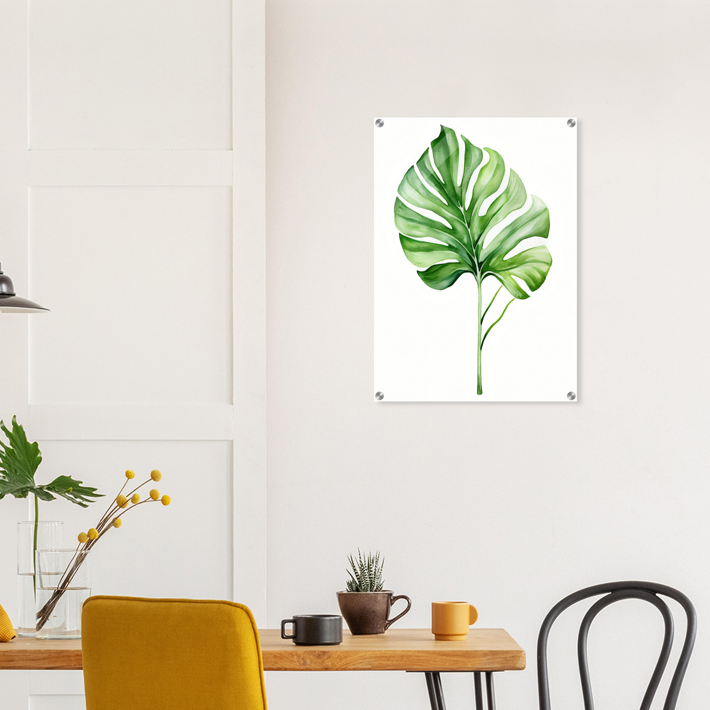 A green leaf on a white background