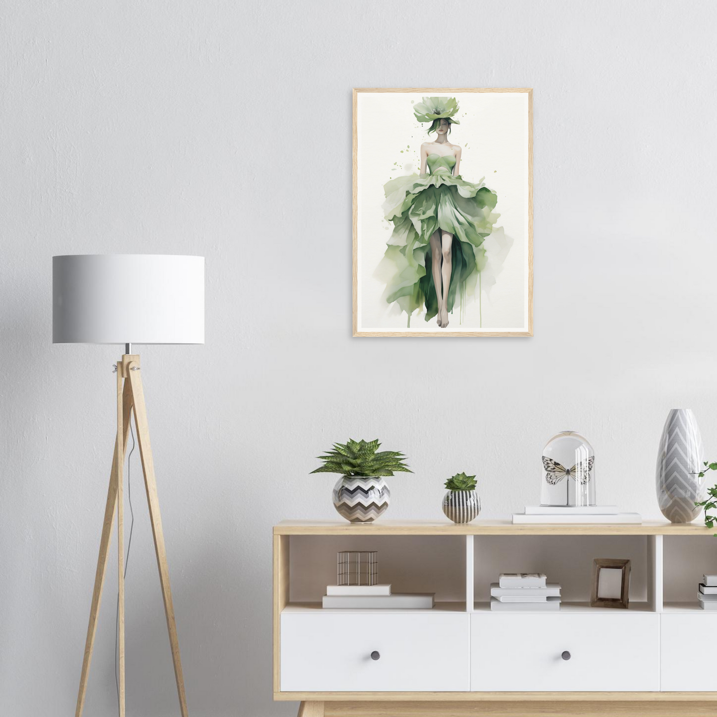 A green plant in a white vase on a white wall