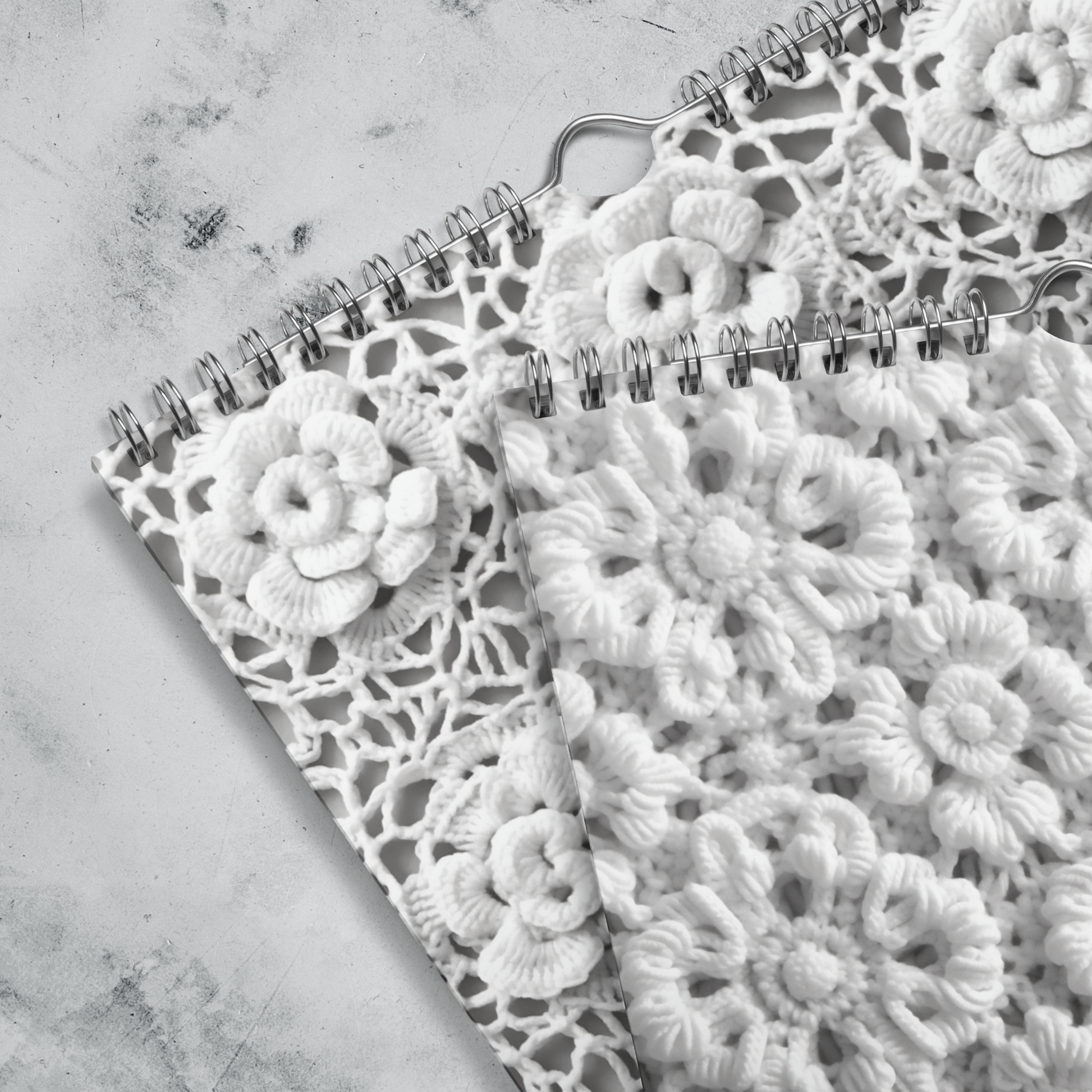 Delicate lace doily with intricate floral patterns and spiral-bound edge.