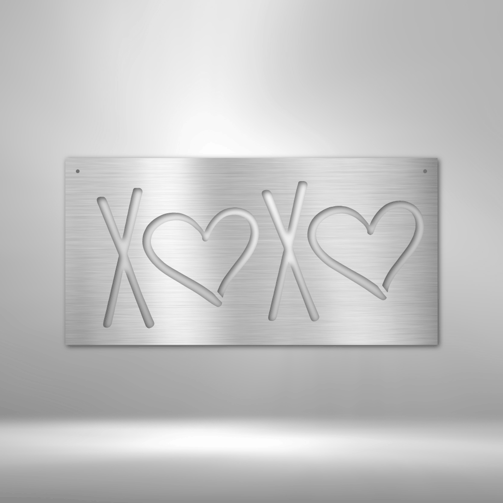 Metal plaque with ’XOXO’ engraved, using hearts for the O’s.