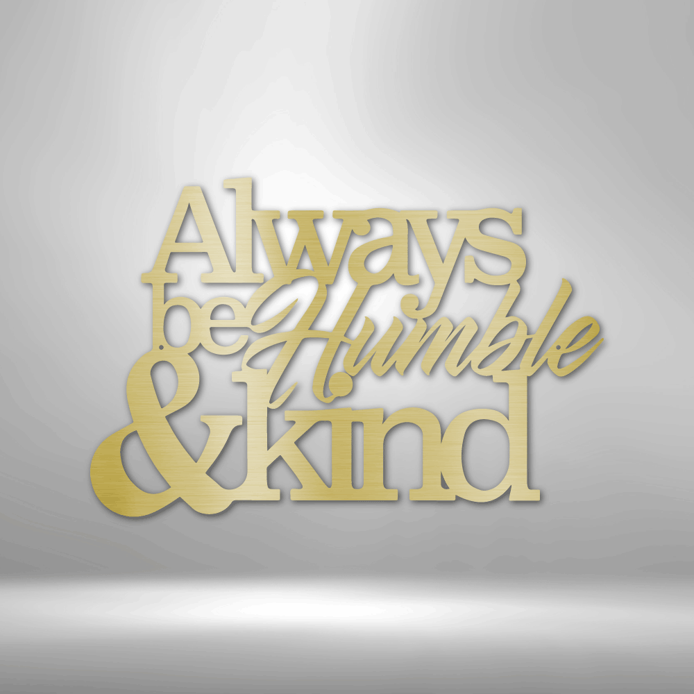 A decorative text sculpture saying ’Always be humble & kind’ in gold-colored material.