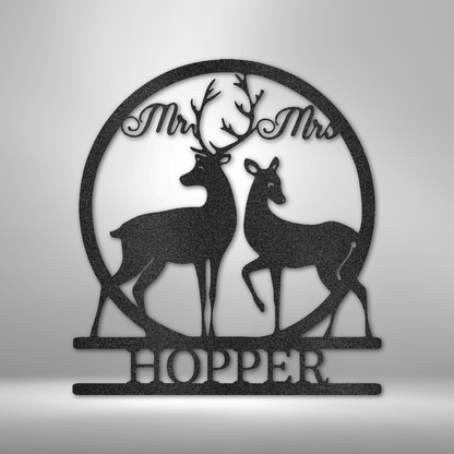 Circular metal wall art featuring silhouettes of two deer and the text ’Mr & Mrs HOPPER’.