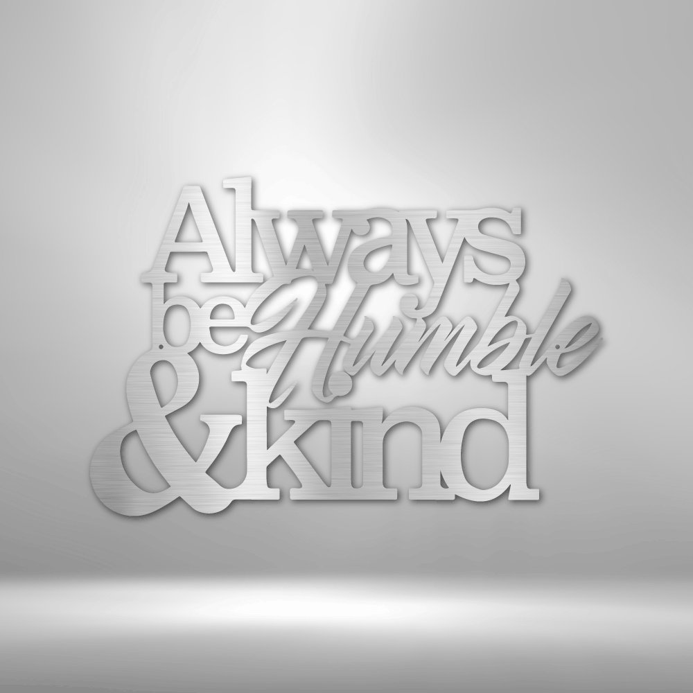 Three-dimensional text sculpture saying ’Always be Humble & kind’ in white letters against a light background.