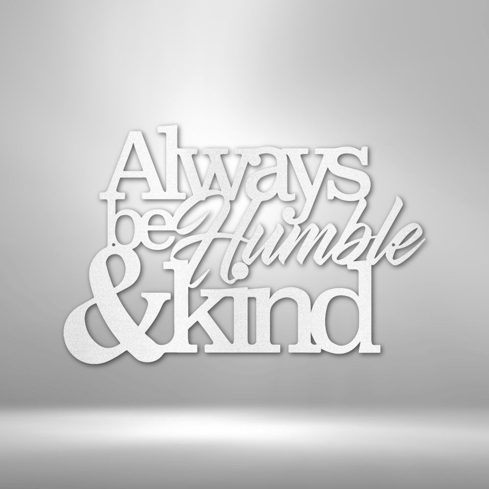 White text sculpture or wall art saying ’Always be Humble & kind’.