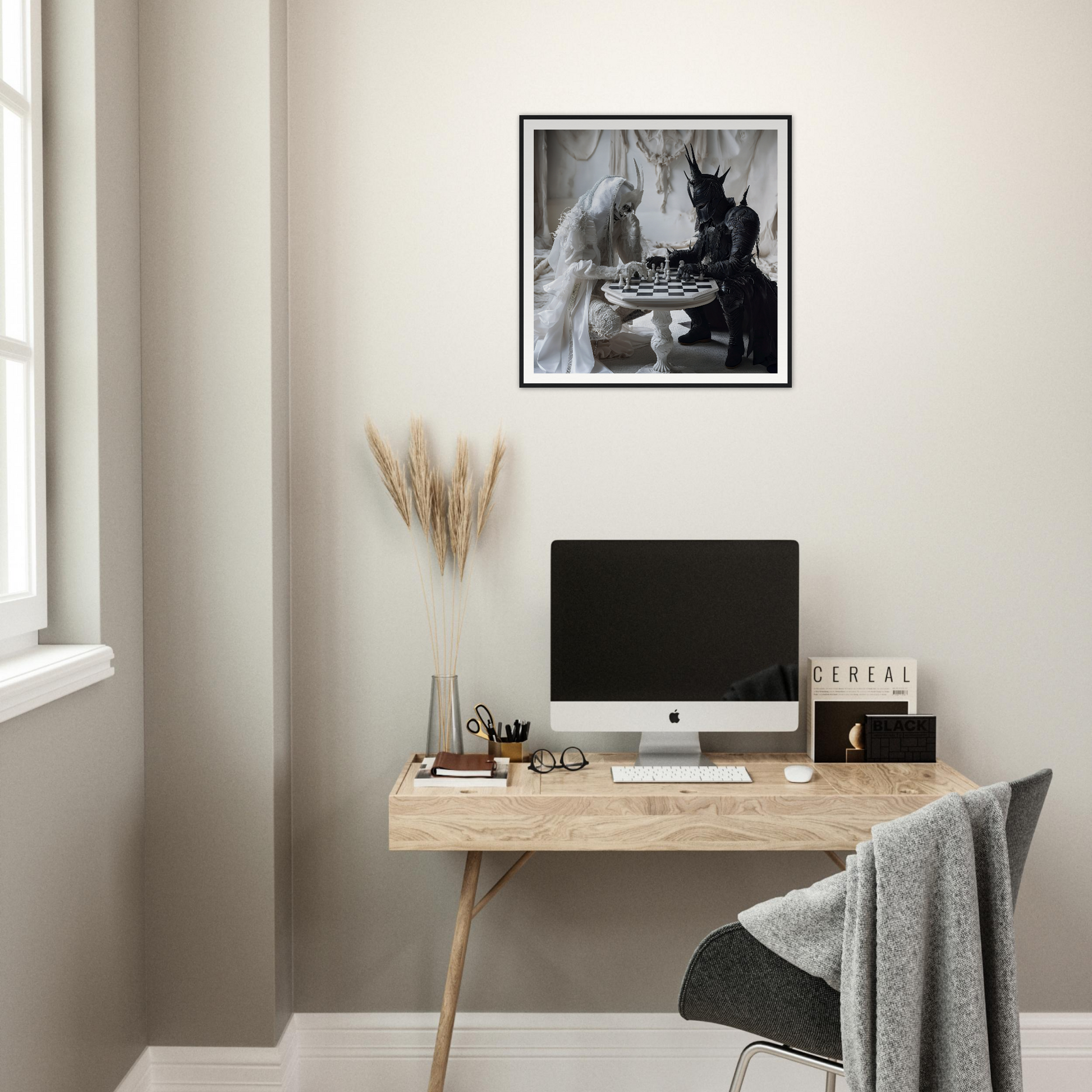 Minimalist wooden desk with iMac and Kindled Celestial Dance framed poster above