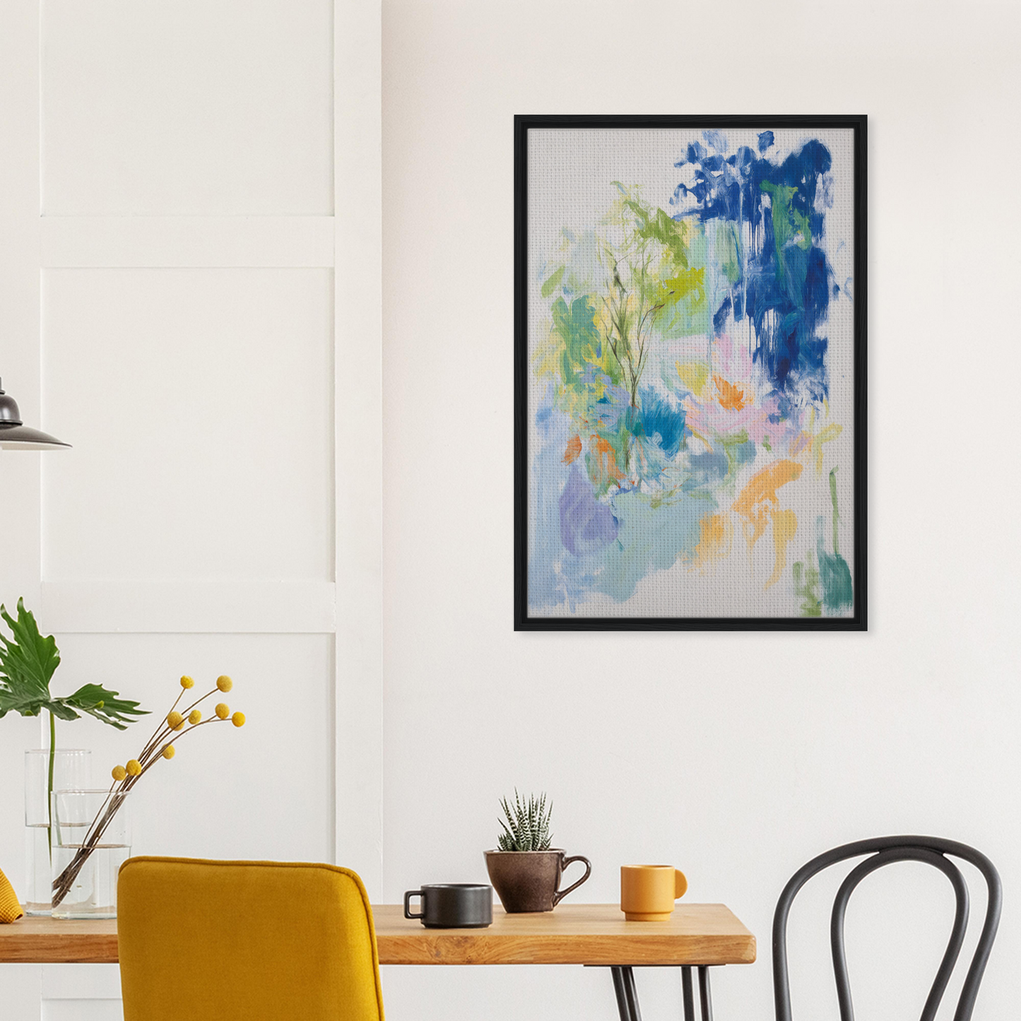 Abstract painting with blue, green, and peach hues in a black frame for Kosmic Painted Continental